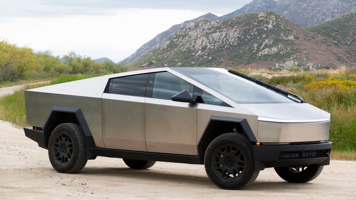 The 2025 Tesla Cybertruck with its stainless steel bodywork seen from a front quarter angle