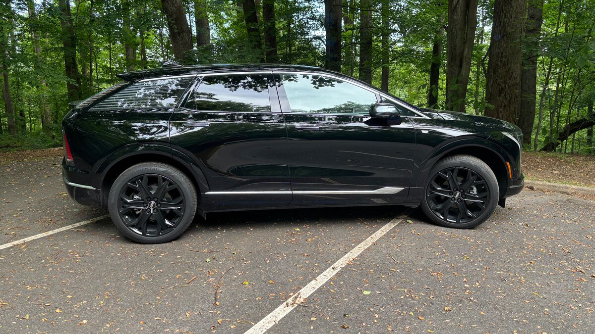 The 2025 Cadillac Optiq in Raven Black seen in profile