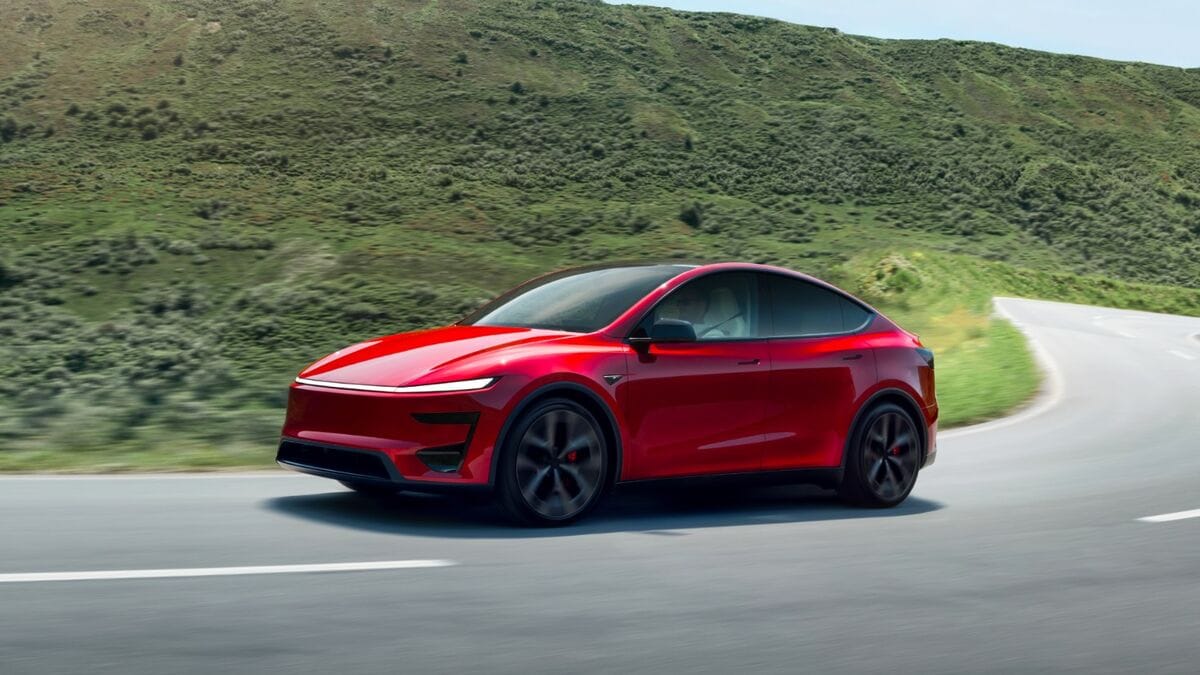 The 2026 Tesla Model Y Performance in red seen from a front quarter angle