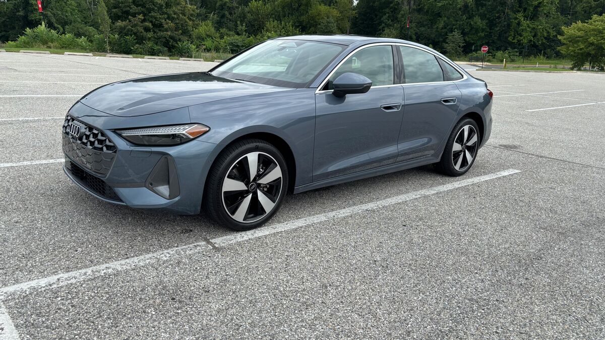 The 2025 Audi A5 in blue seen from a front quarter angle
