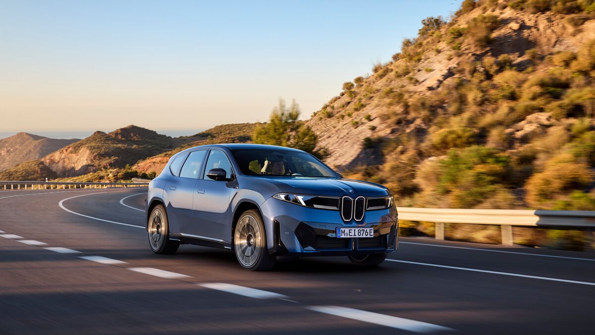 The 2027 BMW iX3 in blue seen from a front quarter angle