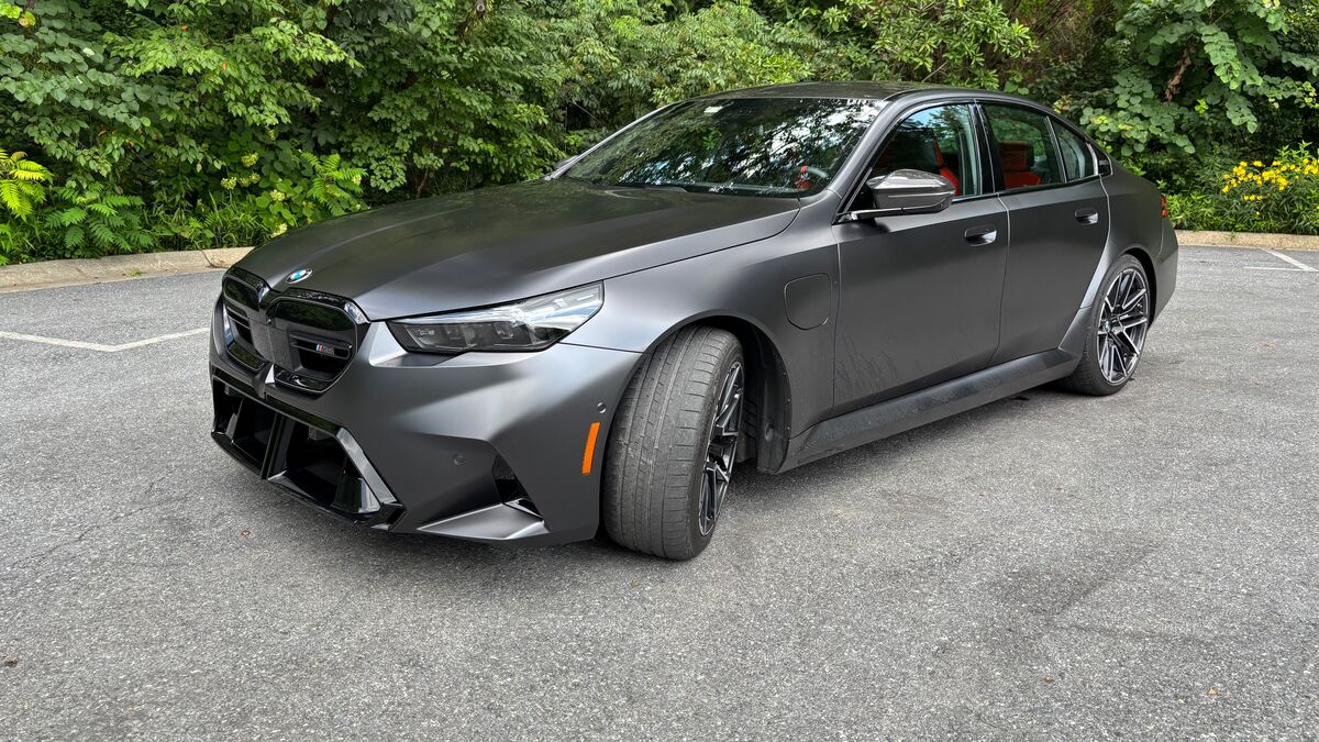 The 2025 BMW M5 in Frozen Deep Grey seen from a front quarter angle