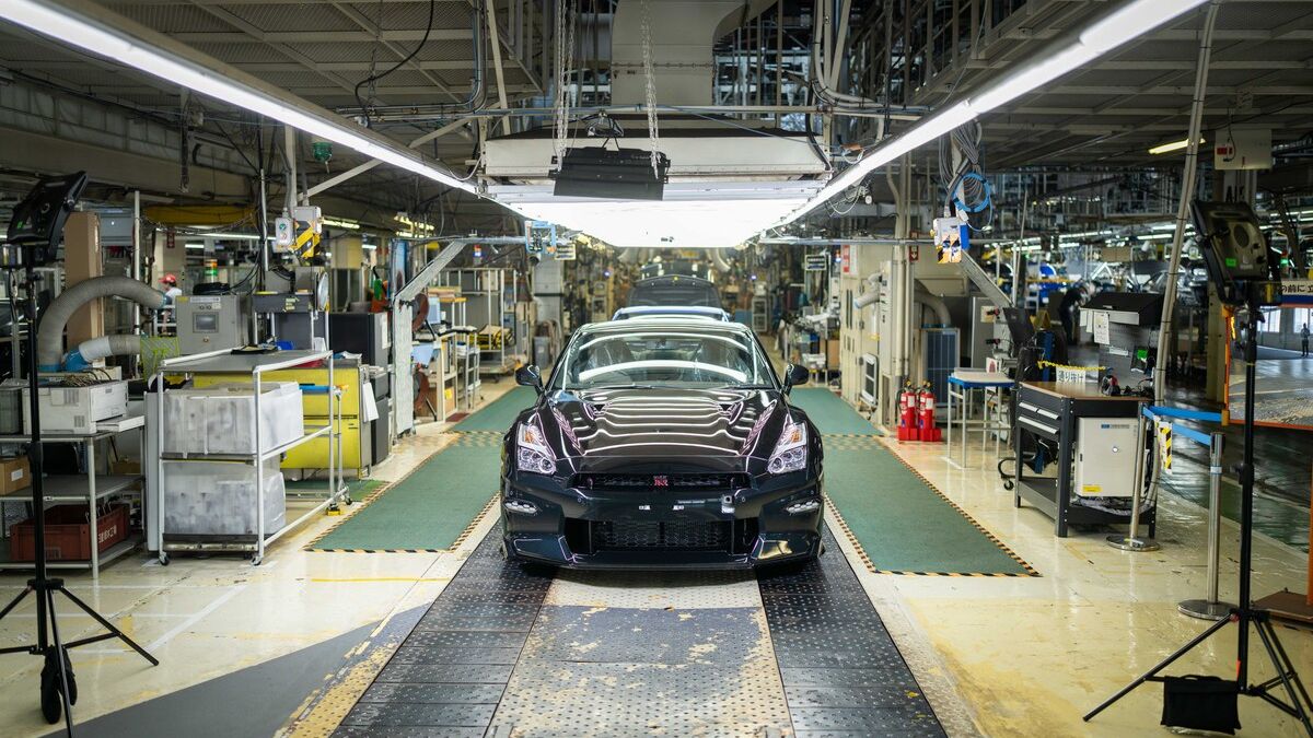 The final Nissan GT-R, a T-Spec model in Midnight Purple, makes its way through the assembly process