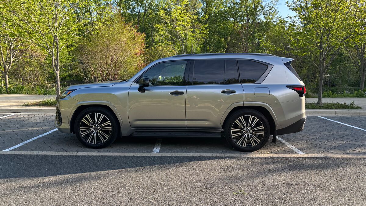 The 2025 Lexus LX 700h Luxury in beige seen in profile