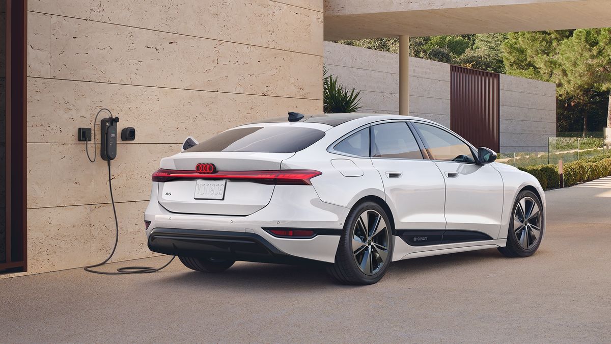 The 2026 Audi A6 e-tron in white plugged in to charge