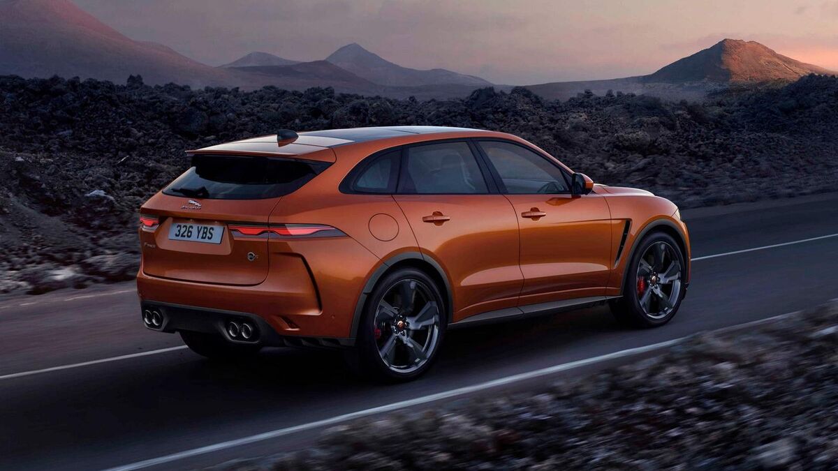 The 2022 Jaguar I-Pace in orange seen from a rear quarter angle