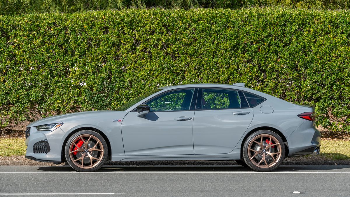 The 2024 Acura TLX sedan in blue seen in profile