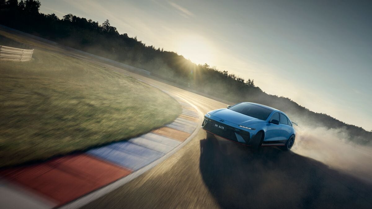The 2026 Hyundai Ioniq 6 N seen from a front quarter angle drifting on a track