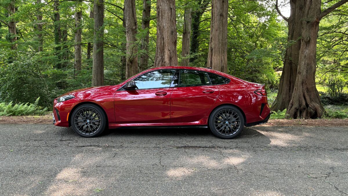 The 2025 BMW M235 xDrive Gran Coupe in red seen in profile
