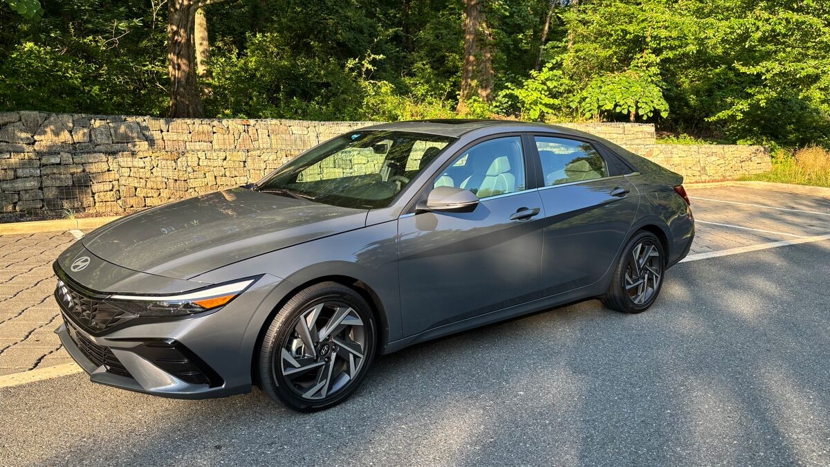 The 2025 Hyundai Elantra Hybrid Limited in gray seen from a front quarter angle