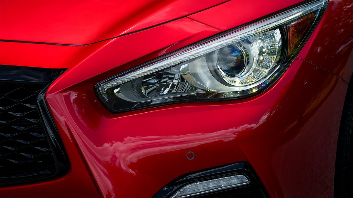 A detailed closeup of one headlight of the 2024 Infiniti Q50, since discontinued