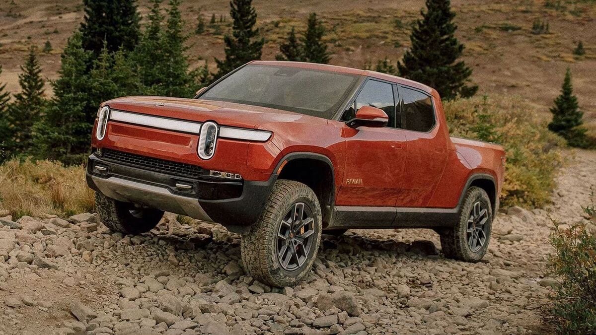 2025 Rivian R1T in a burnt orange color.