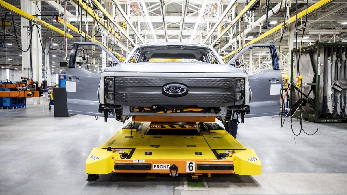 A Ford F-150 Lightning pickup under construction in a factory
