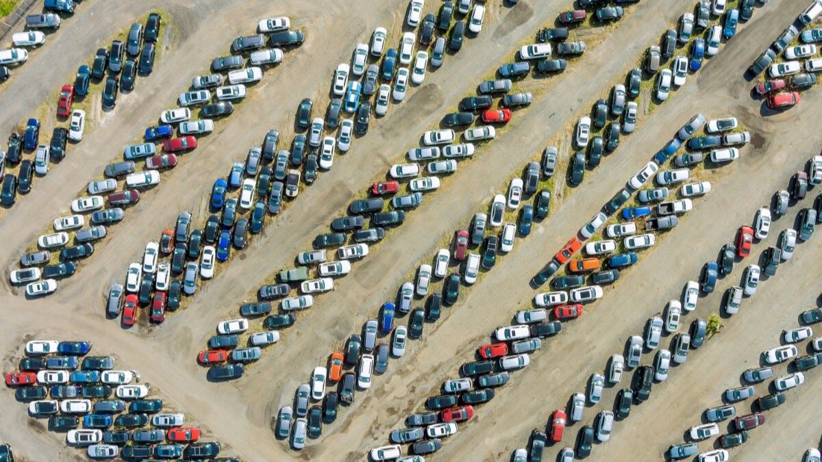 An aerial photo showing hundreds of used cars lined up for sale in an auction lot