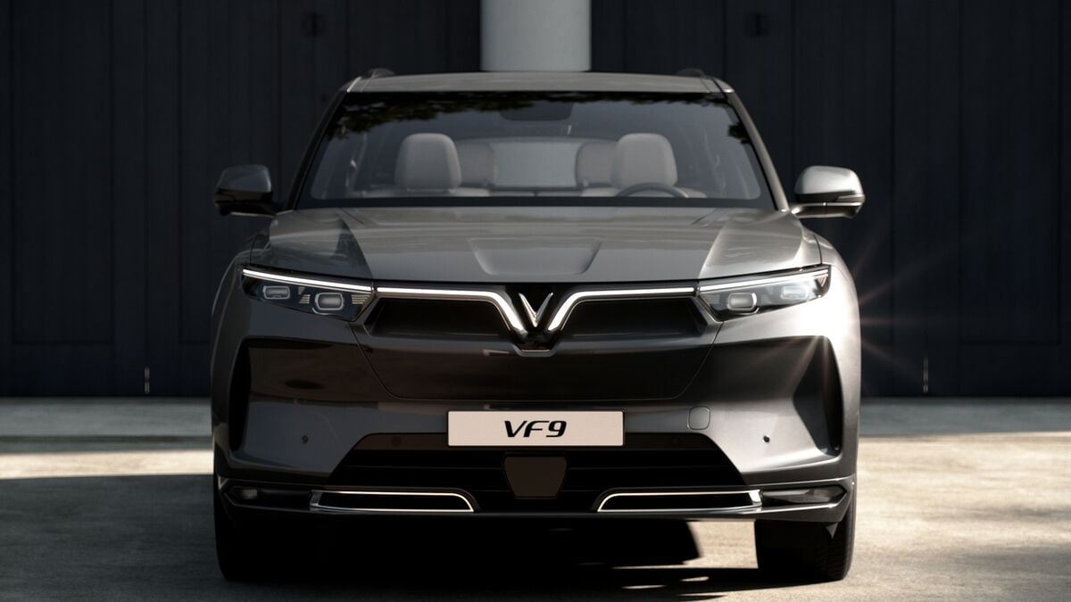 The 2023 VinFast VF 9 electric SUV in gray seen from head on