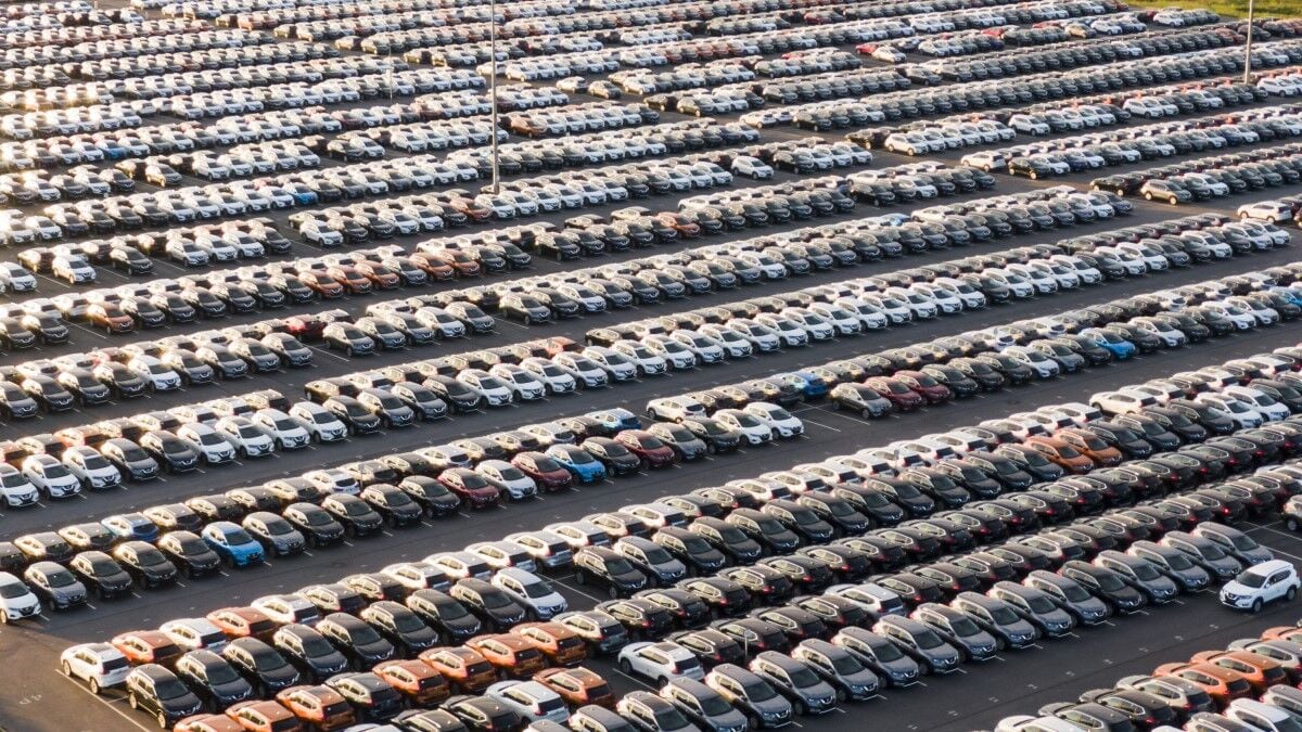 Thousands of cars in a port, awaiting delivery to dealerships