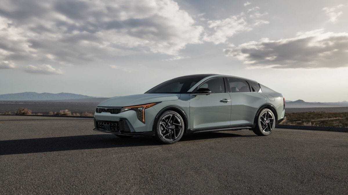 The 2025 Kia K4 sedan in gray seen from a front quarter angle