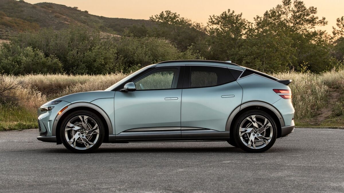 The 2023 Genesis GV60 SUV in blue seen in profile