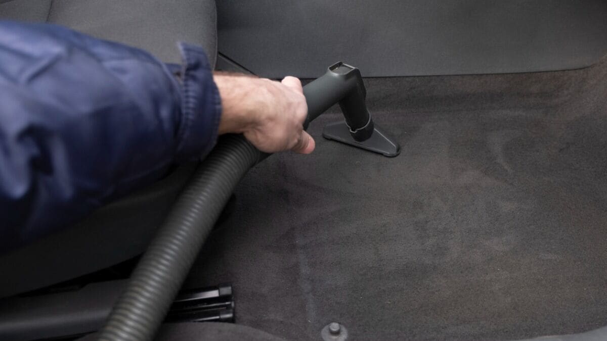 man-is-vacuuming-a-car-interior-picture-id1221056803.jpg