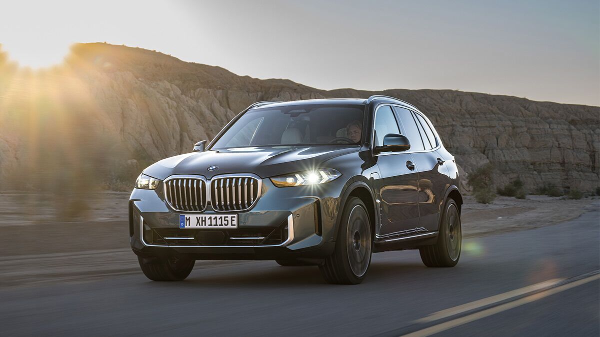 The 2026 BMW X5 in blue seen from a front quarter angle