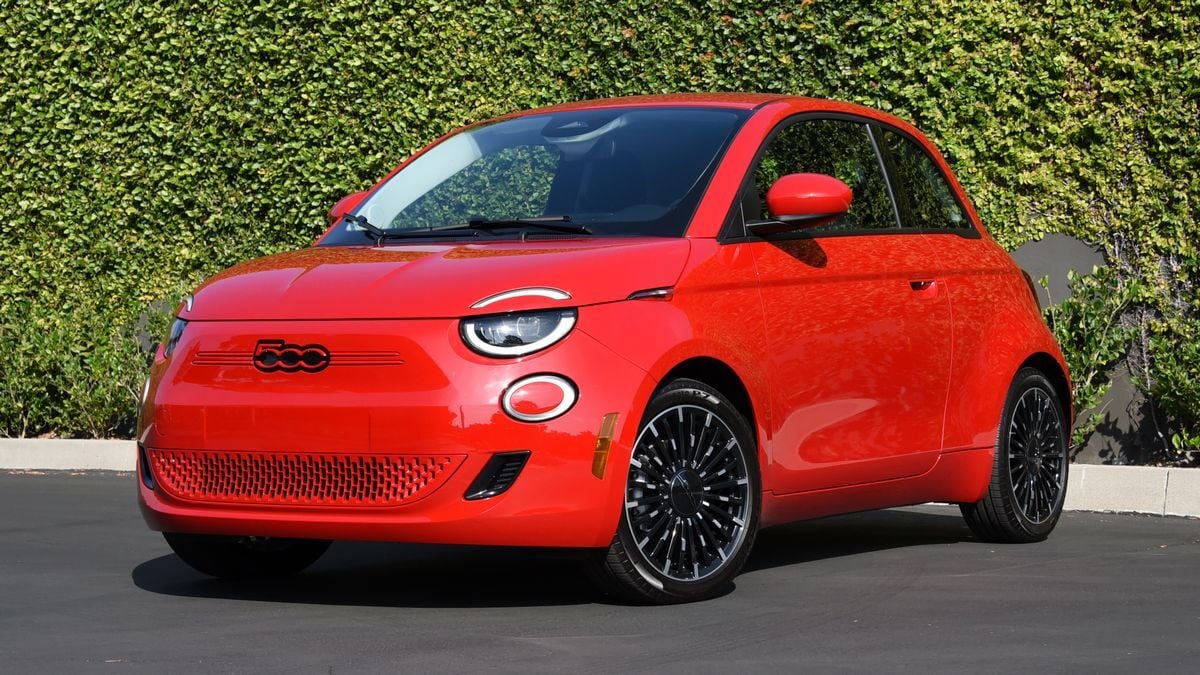 The 2024 Fiat 500e in red seen from a front quarter angle