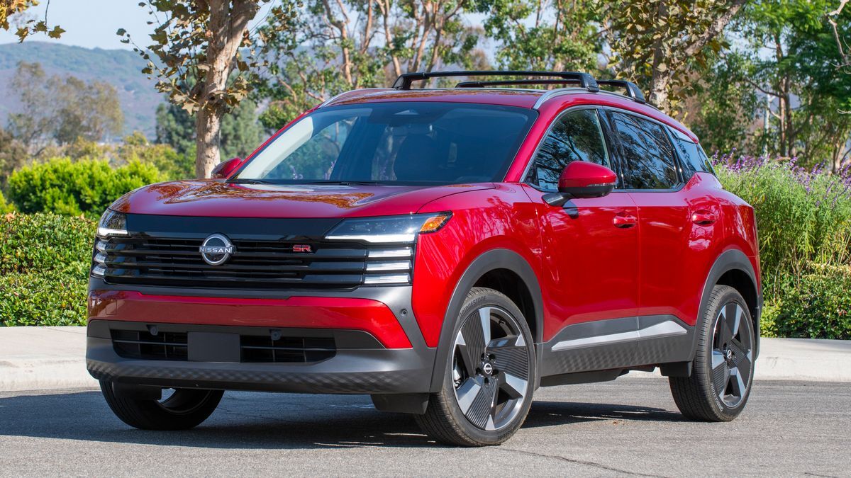 2025 Nissan Kicks parked near bushes.