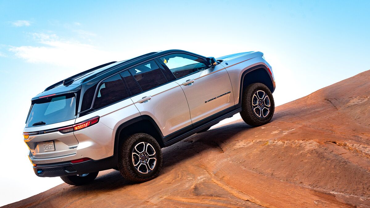The 2024 Jeep Grand Cherokee 4xe Trailhawk in silver parked on an incline