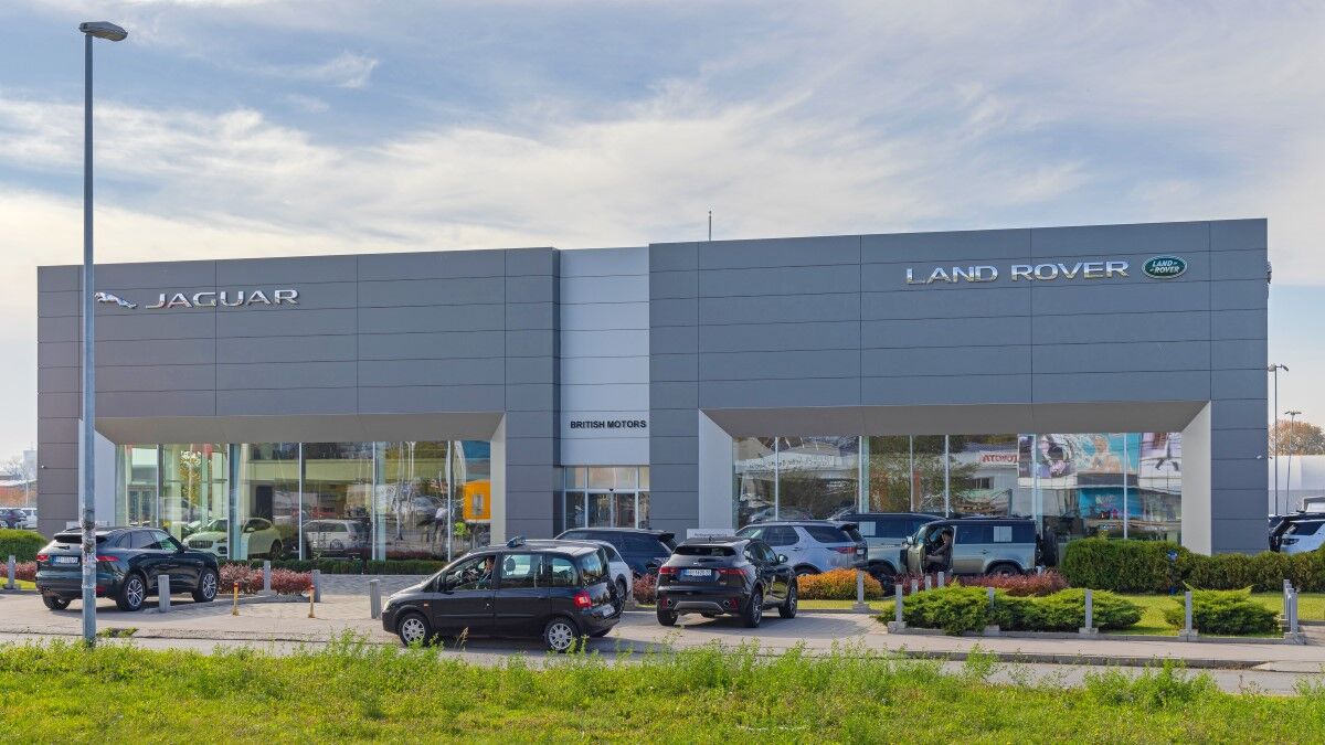 Cars lined up for sale outside a Jaguar Land Rover dealership