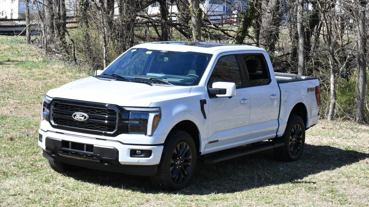 The 2025 Ford F-150 Hybrid in white seen from a front quarter angle