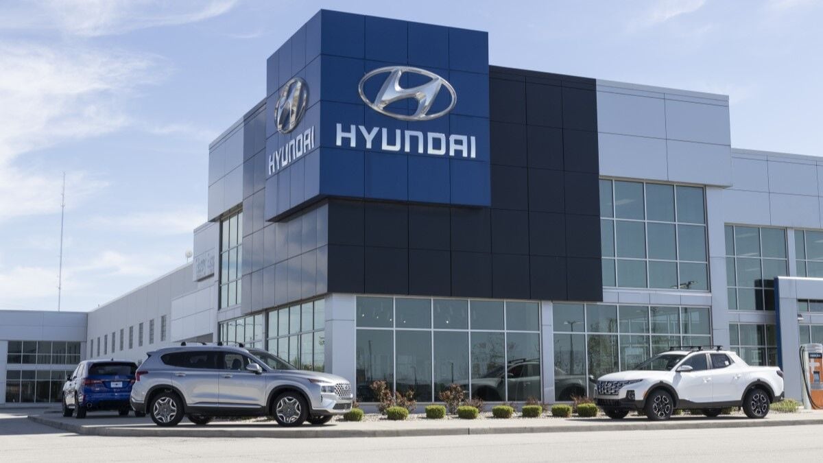 Several SUVs and pickup trucks parked outside a Hyundai dealership