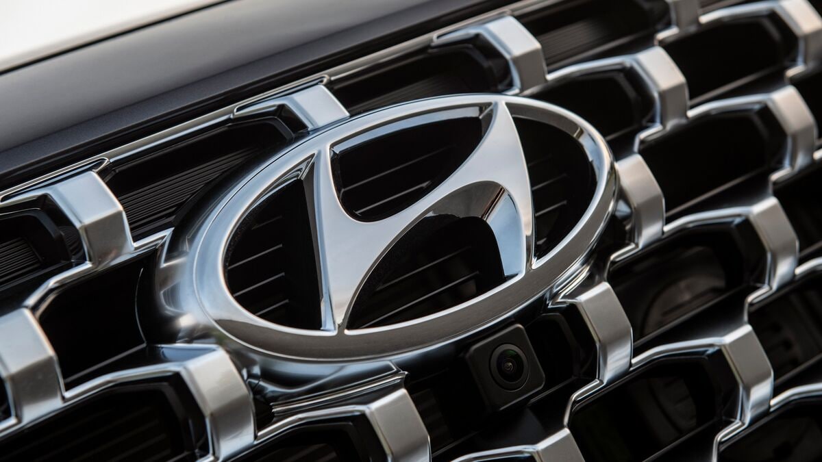 A Hyundai logo in closeup on the grille of a 2021 Hyundai Santa Fe