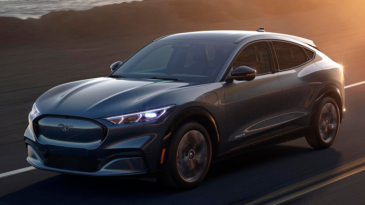 The 2021 Ford Mustang Mach-E in gray seen from a front quarter angle