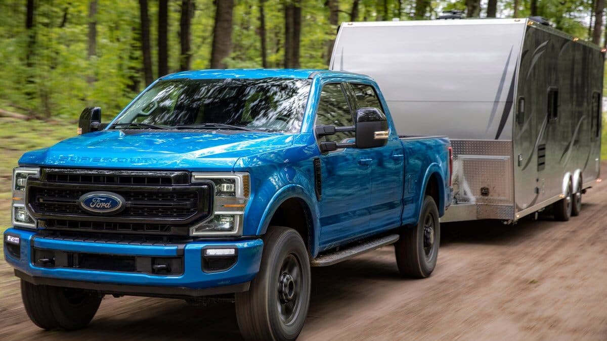 The 2020 Ford F-250 Super Duty seen from a front quarter angle towing a trailer