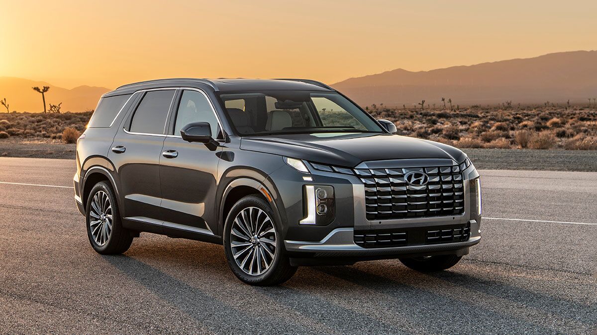 2025 Hyundai Palisade parked on the road with the sun setting.