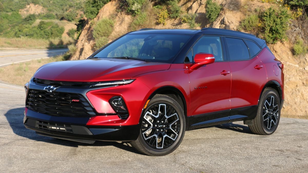 The gas-powered 2025 Chevrolet Blazer in red seen from a front quarter angle