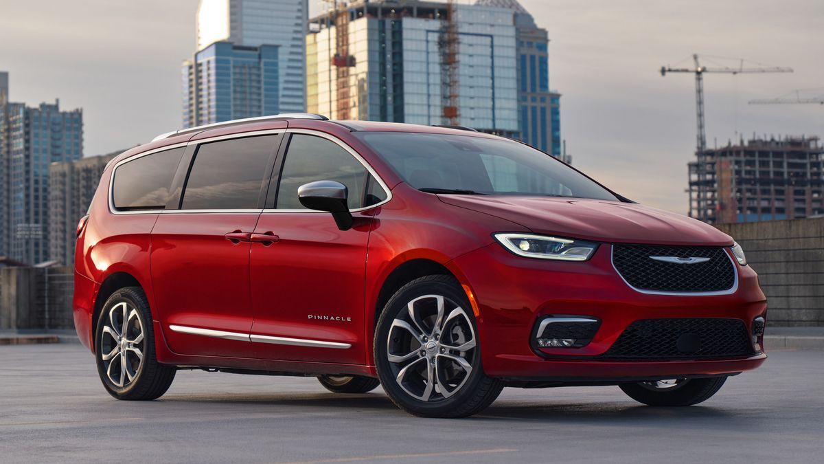 The 2025 Chrysler Pacifica in red seen from a front quarter angle
