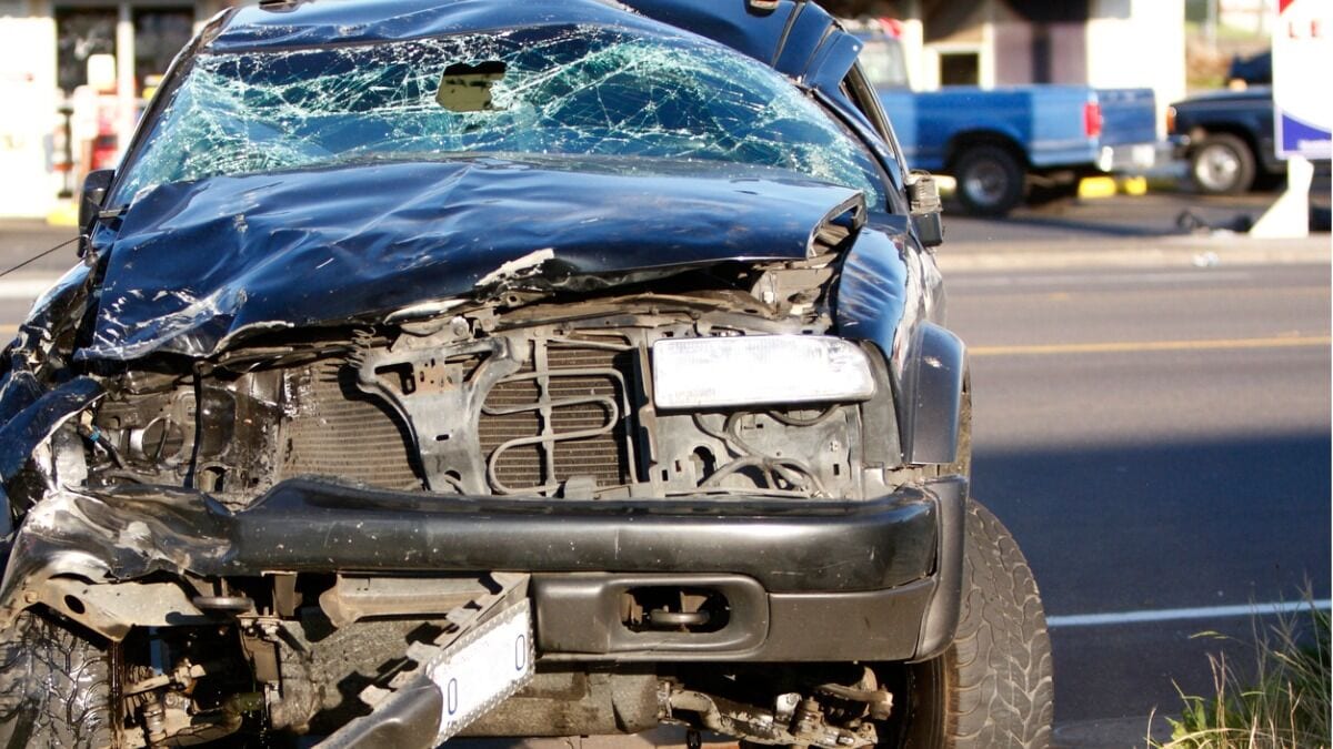 A car badly damaged after a collision, seen from head on