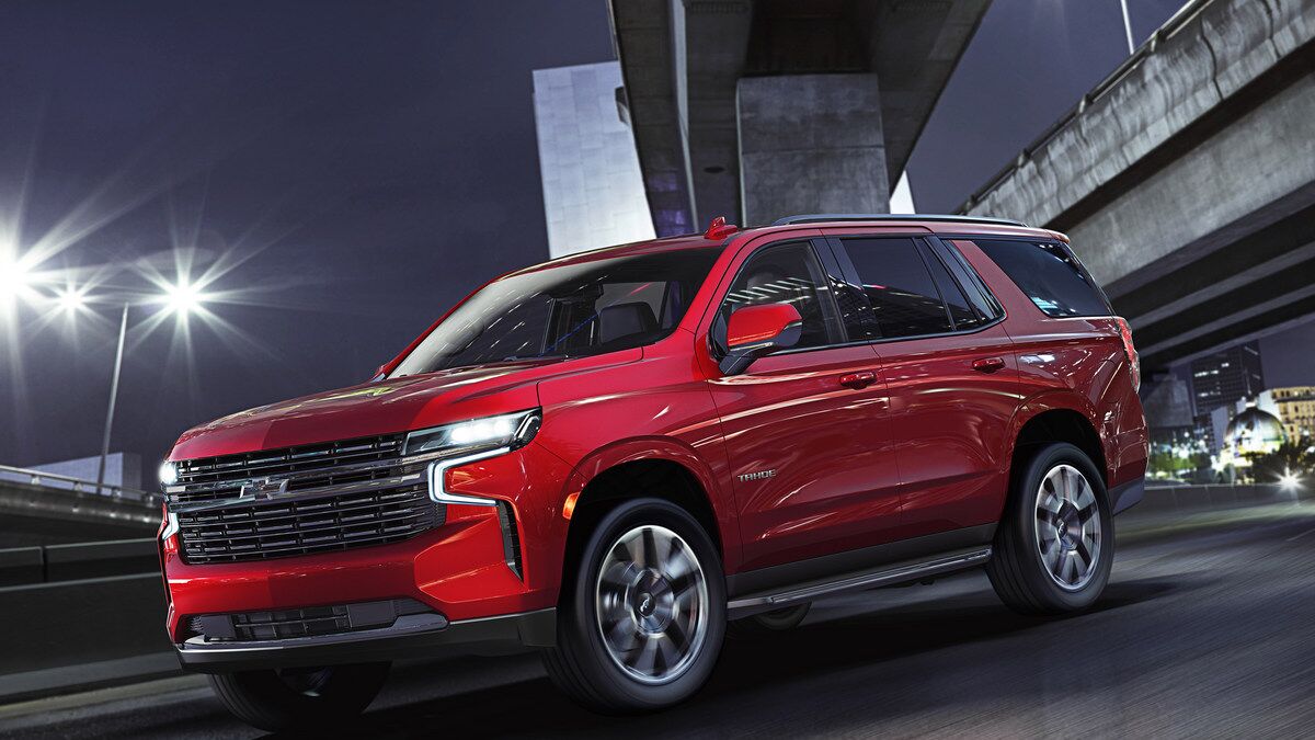The 2021 Chevrolet Tahoe in red seen from a front quarter angle